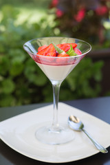 Strawberry panna cota in a martini glass - 185926996