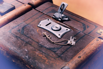 Opened lock of old styled suitcase with key