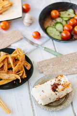 Roasted tofu - popular vegetarian cheese, in metal plate.