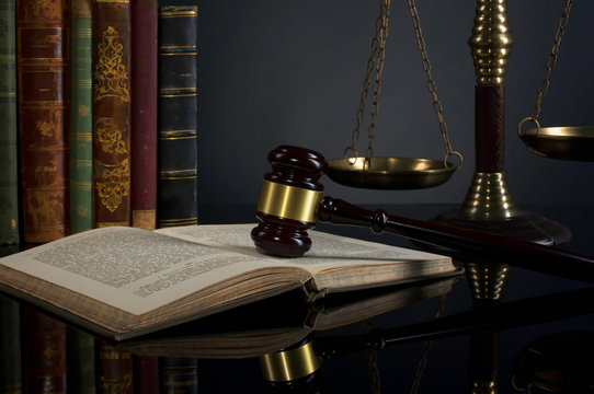  law theme, mallet of the judge, justice scale, old books, wooden desk