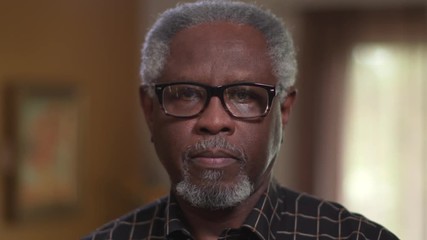 An elderly African American male, sad or feeling depression, looking at camera in close up authentic portrait. - Powered by Adobe
