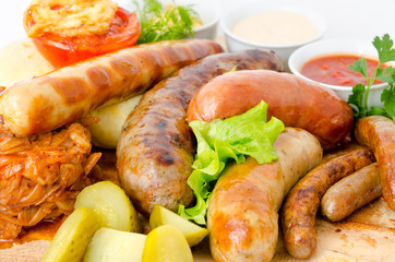 various sausages with sauces