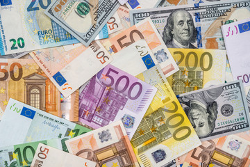 Fototapeta na wymiar Two leading currencies - dollar and euro bills for desing