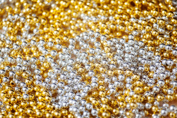 Silver and gold beads. Texture, background.