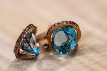 Gold earrings with clear blue crystals