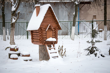 Wooden hut at the winter