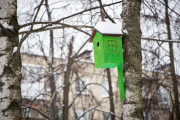 Birdhouse on a tree at the winter