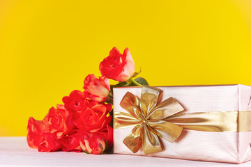 Bunch of orange roses on table