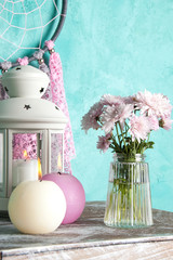 Dream catcher on aquamarine wall background
