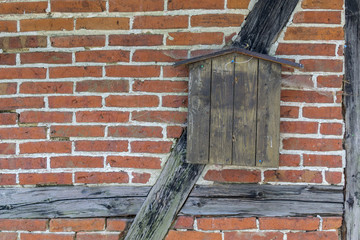 Background of beams and bricks. Detail of the exterior old building.