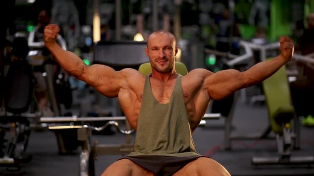 bodybuilder posing in gym