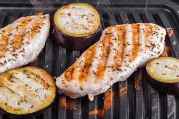 Fillet of chicken breast and eggplants cooked on electrograss. Proper nutrition home cooking