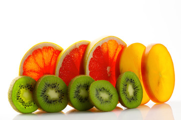 Fresh ripe juicy and appetizing grapefruit with kiwi and persimmon and their parts close-up,...