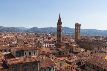 Fototapeta na wymiar Red roofs of Florence from Palazzo Vecchio in a sunny day, Tuscany, Italy.