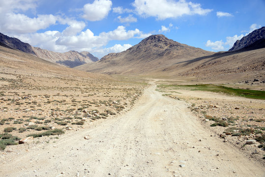 Long distance cycling in the Wakhan valley, Pamir Mountain Range, Tajikistan