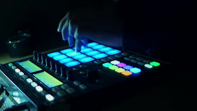person dj plays live drums on the audio controller