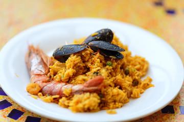Paella. Rice with king prawns, mussels and lemon