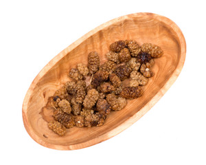 Organic unsulfured dried mulberries in wooden bowl
