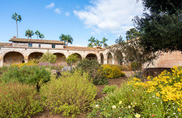 Garden and cart in San Juan Capistrano mission