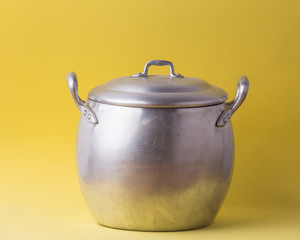 old pan with yellow background