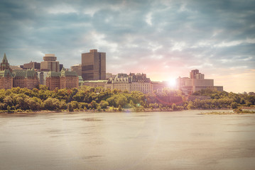 View of old buildings from the other side of the Ottawa River. - obrazy, fototapety, plakaty
