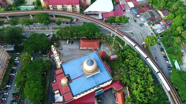 Aerial view. A light rapid transit train in the city.