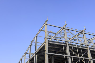 Is the construction of the steel structure factory building under the blue sky