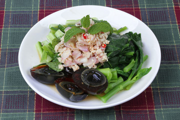 Spicy cucumber salad with dried shrimp and  preserved egg.