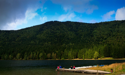Telephoto shot of the volcanic Lake Sfanta Ana, Tusnad, Romania. It is the only crater lake in Romania, in the  volcano named Ciomatu Mare in the Eastern Carpathians