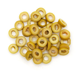 Bunch of cut green olive rings on a white background