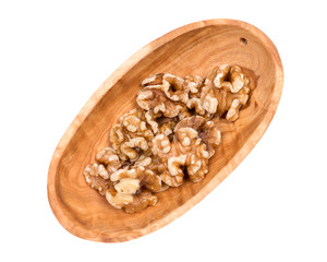 Raw premium walnut halves in wooden vintage bowl
