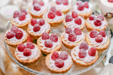 Raspberry cupcake desserts with pink cream
