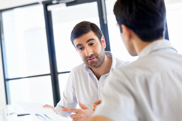 Fototapeta premium Image of two young business people in office
