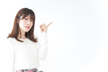 Young woman pointing to something