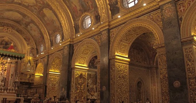 MALTA &ndash; AUGUST 2016 : Video shot inside Valletta Church with beautiful interior and people in view