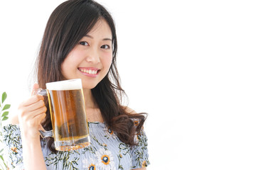 Young woman cracking a beer in beer garden