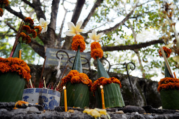 candles in ceremony with banana leaf