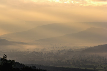 Beautiful mountain landscape under mist in the morning.