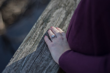 Wedding ring contrast on wooden background