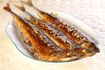 Grilled saury on the plate    