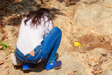 Woman hiking around mountains near the river at spring time.