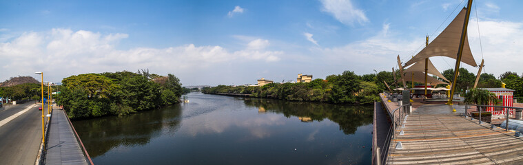 Panoramic view of Pedestrian walkway and park on the banks of Estero Salado in the city of Guayaquil - obrazy, fototapety, plakaty