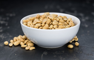 Roasted Peanuts on a slate slab (selective focus)