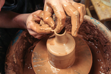 Potter at work. Workshop place.