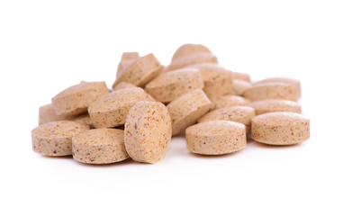 Pills of vitamin C isolated on white background.