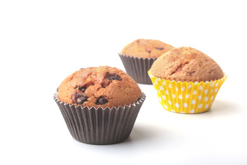 Homemade muffin with raisins and chocolate cupcake. Isolated on white background. selective focus