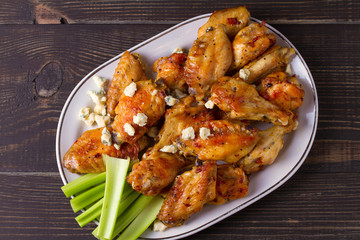 Chicken wings buffalo with blue cheese and celery sticks. View from above, top, horizontal