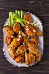 Chicken wings buffalo with blue cheese and celery sticks. View from above, top, horizontal