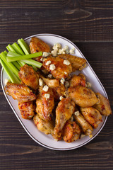 Chicken wings buffalo with blue cheese and celery sticks. View from above, top, horizontal