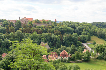 Cityscape of medieval old town Rothenburg ob der Tauber with towers, Germany